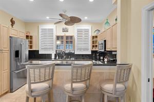 Chef can easily chat with family and friends at the breakfast ba