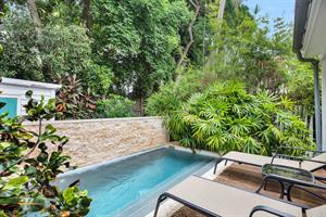 Lush tropical foliage adds to the privacy.
