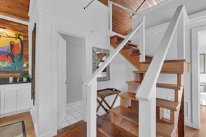 Full bath near the stairs to the loft lets go up