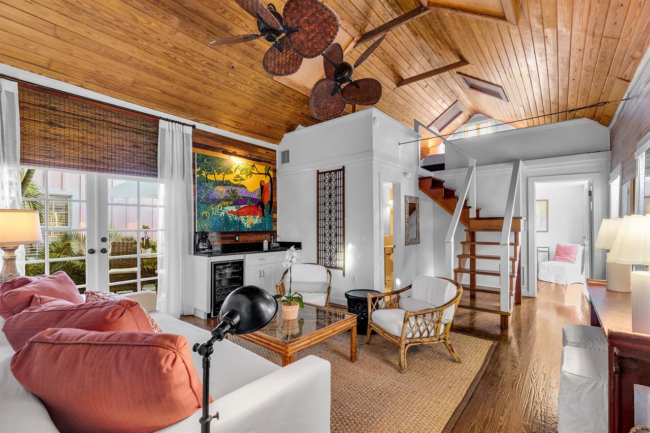 Living room with open staircase to loft