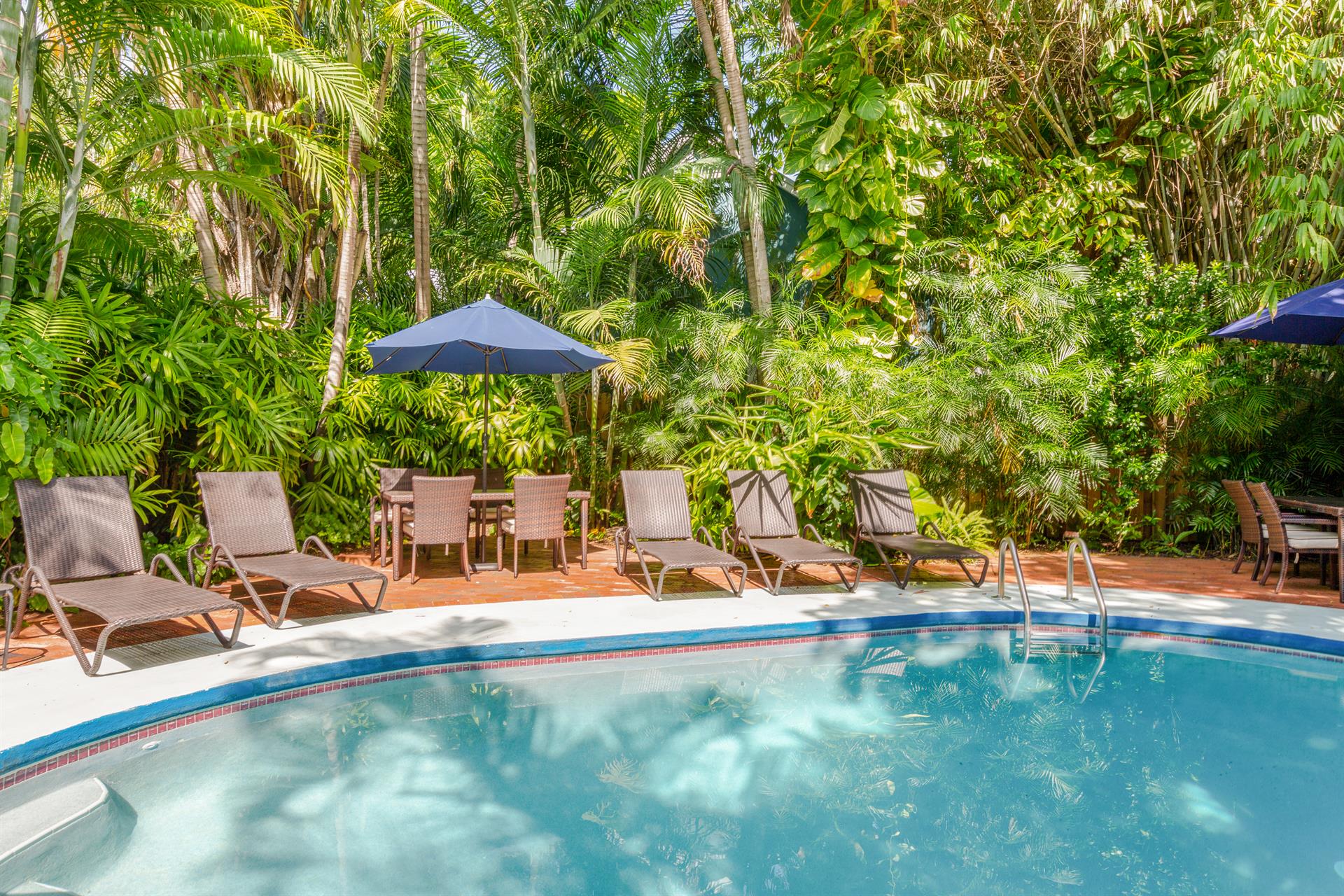 Spacious pool is shared by three units.