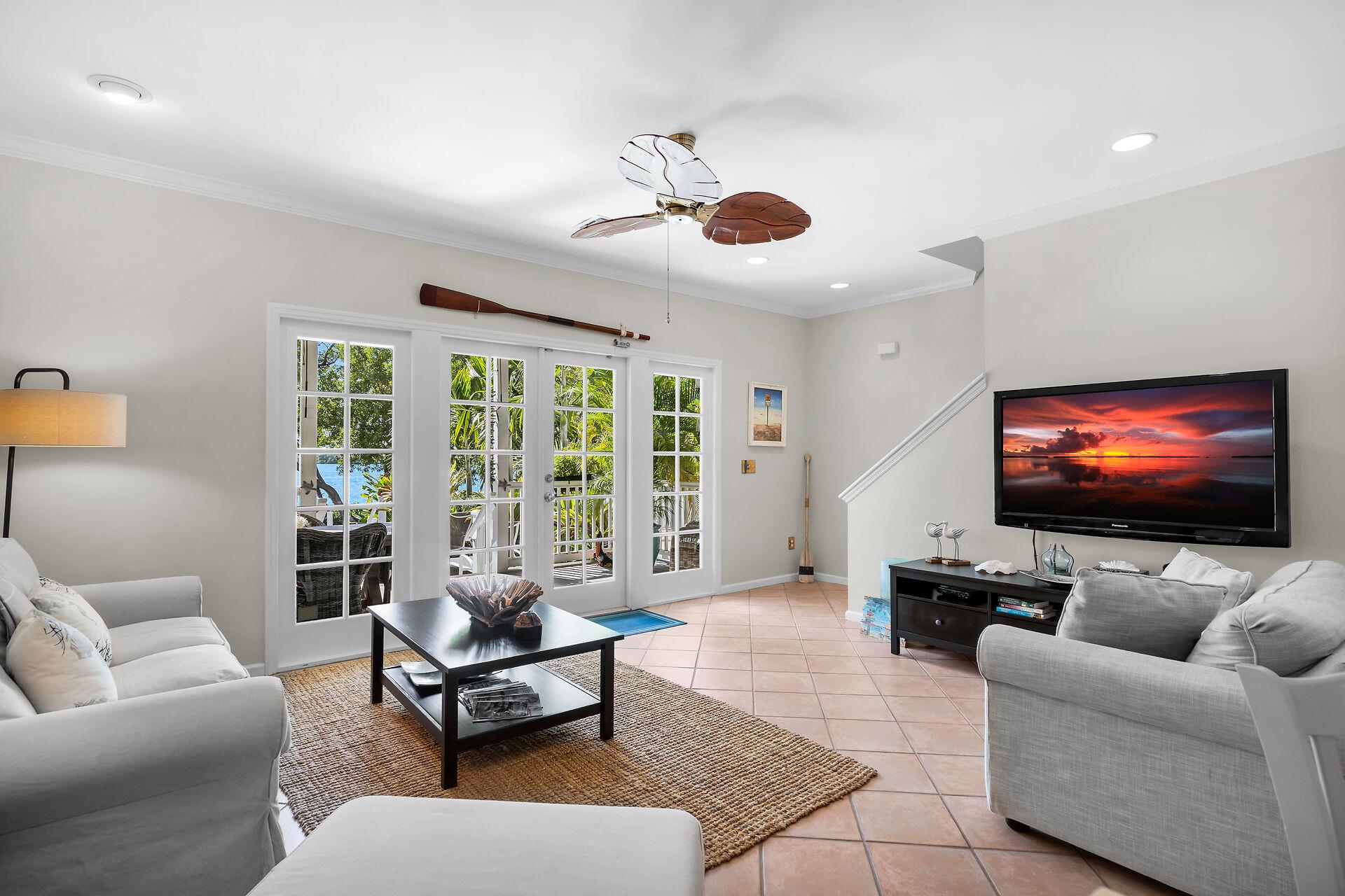 French doors lead to the deck and cocktail pool