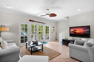 French doors lead to the deck and cocktail pool