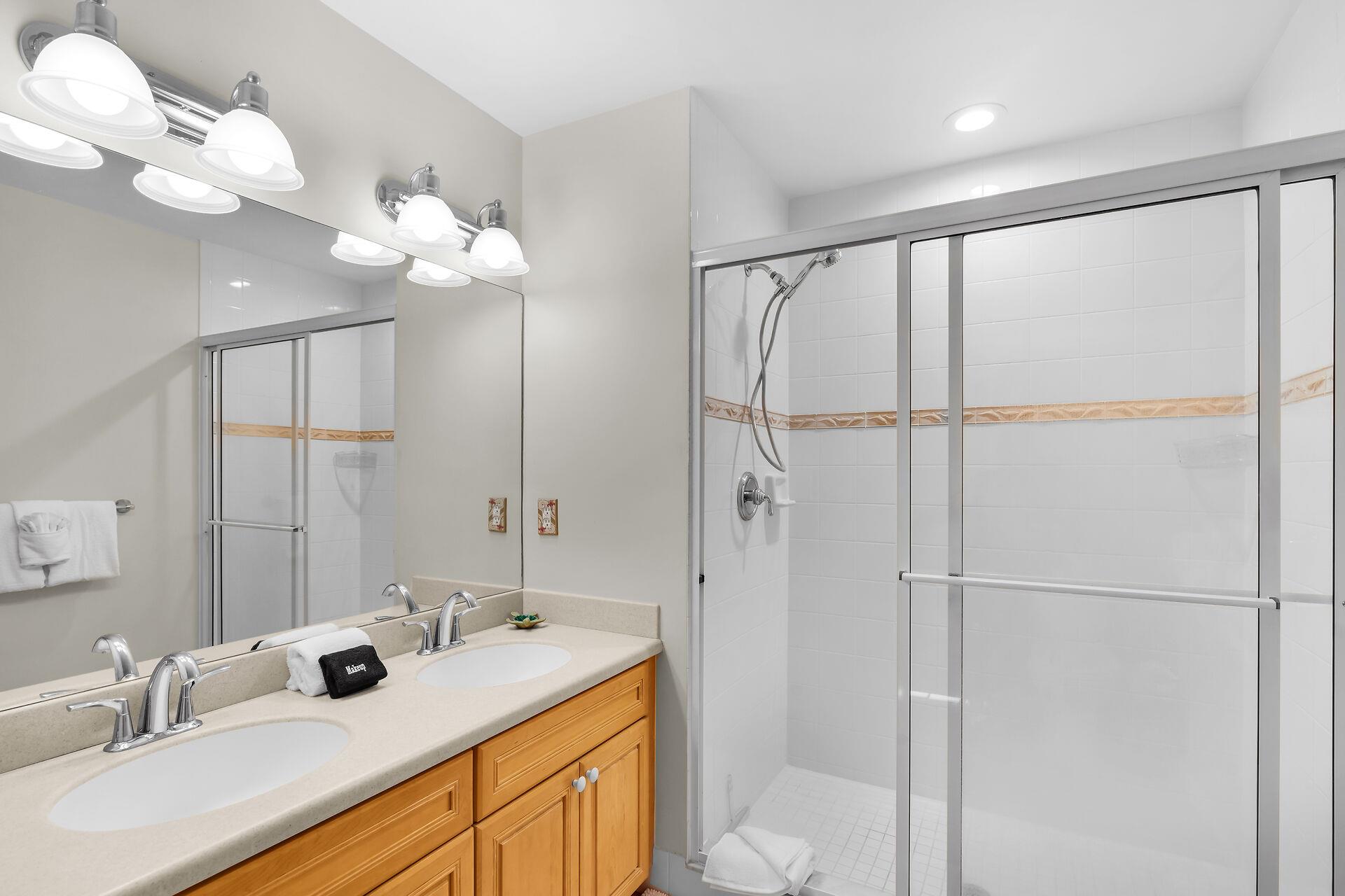 Primary ensuite has double sinks and walk in shower