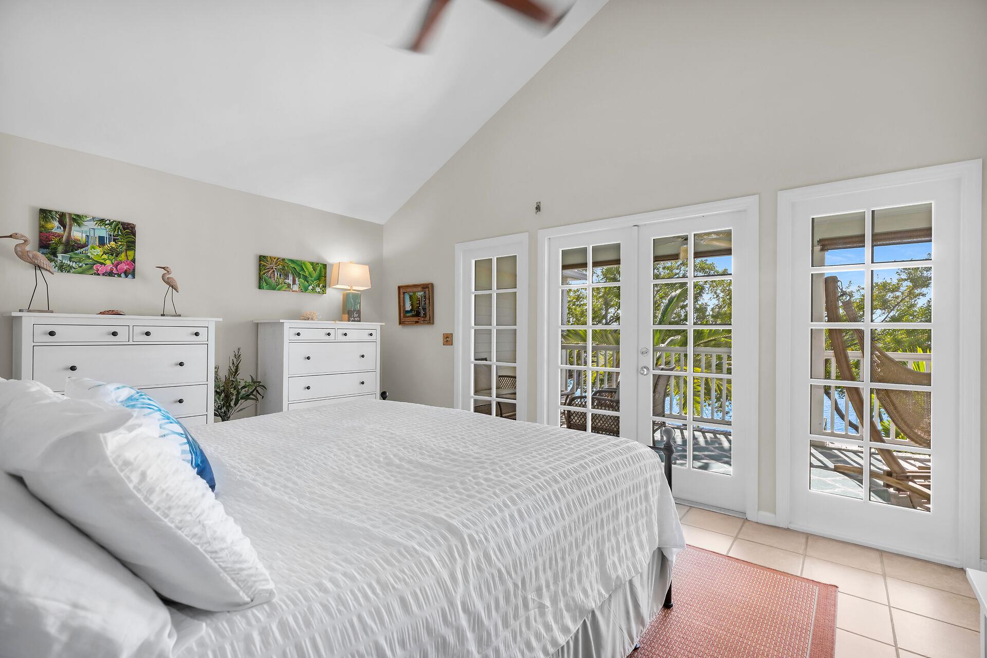 King primary bedroom with ensuite and balcony