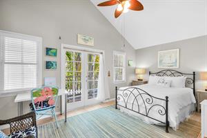 Guest bedroom with ensuite, desk and balcony