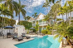 Large shared pool with loungers just steps away