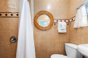 Full bath with walkin shower and pedestal sink