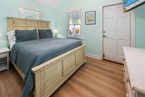 Queen bed at Margarita, with porch access