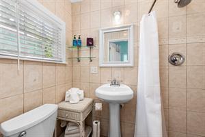 Tile bathroom with walkin shower