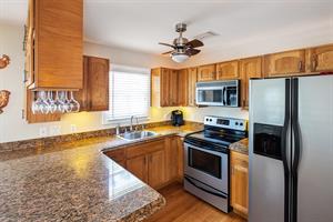 Modern kitchen with stainless steel appliances.