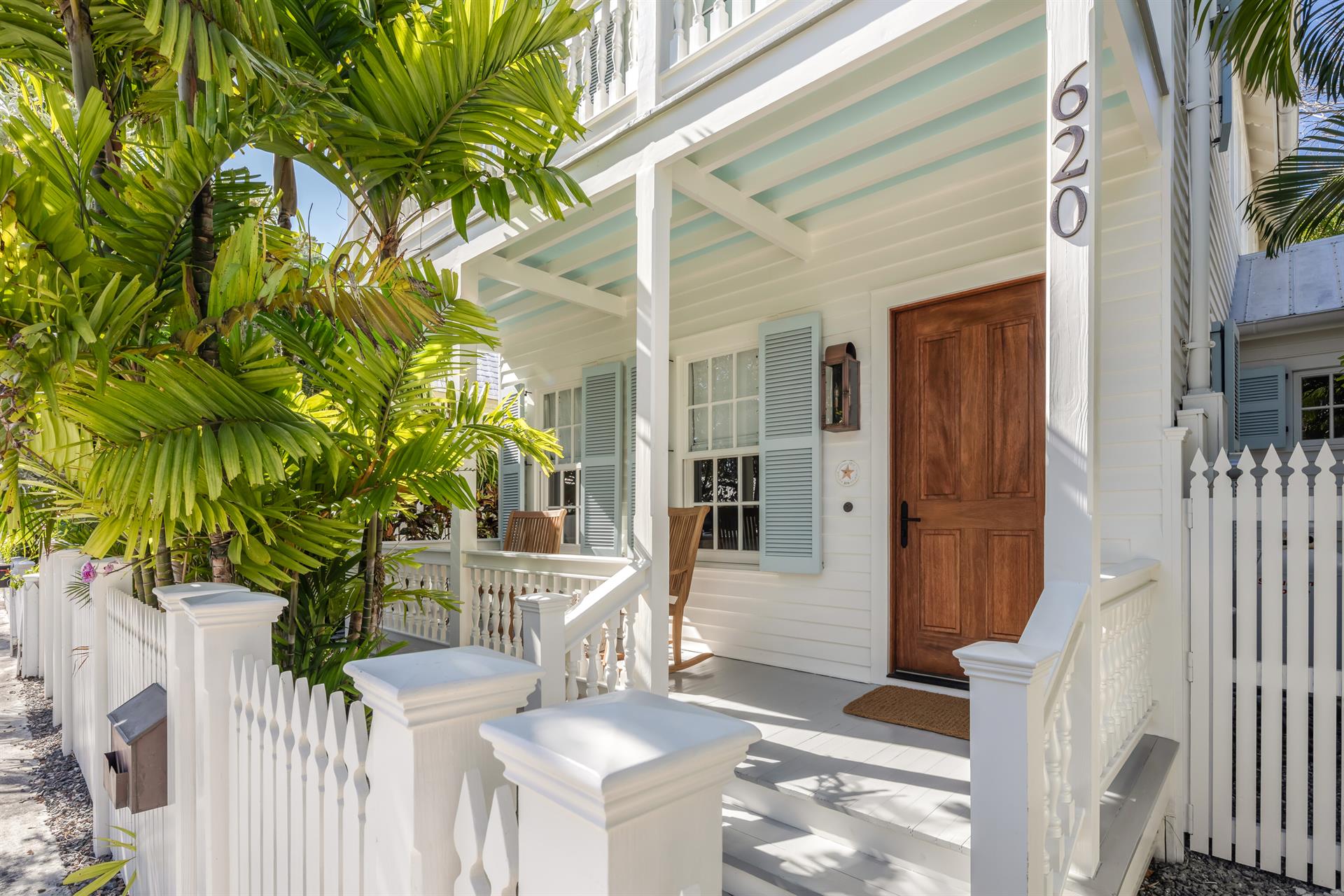 Endearing white picket fence adds to the beauty.
