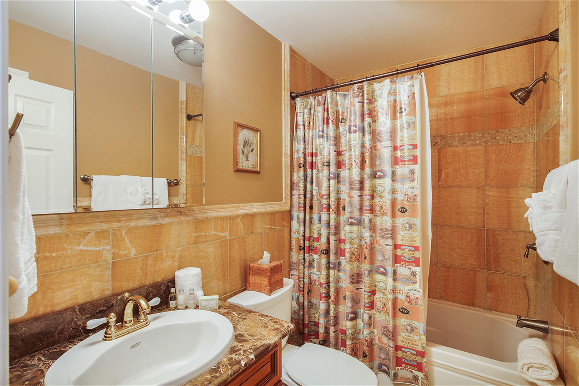 We love the updated pumpkin granite vanity and shower.