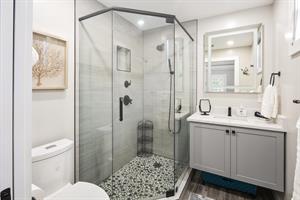 Primary ensuite bath with glass walkin shower
