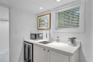 Kitchenette with sink and ice bucket