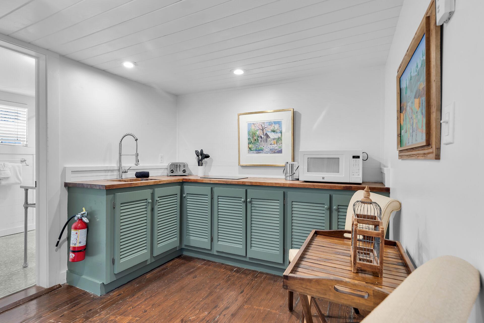 Kitchenette with microwave, sink and small cooktop