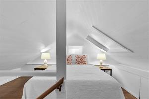 Queen bed in the open loft