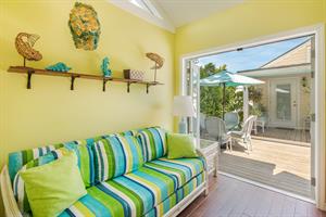 Queen sleeper sofa in the small pool house Perfect for guests.