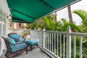 Covered private deck off the primary bedroom.