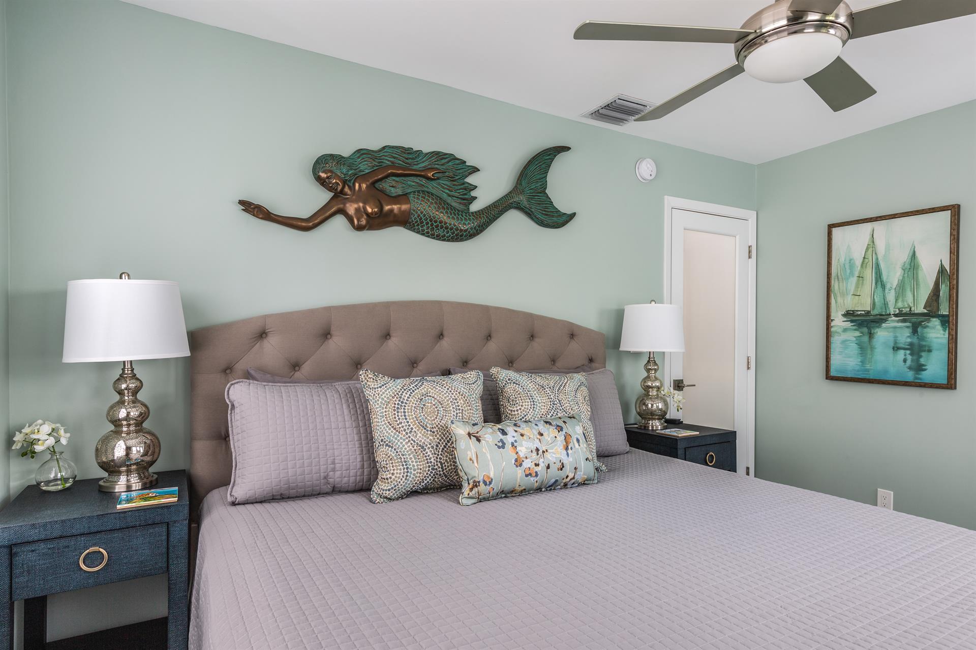 Comfy king bed with bedside lighting.