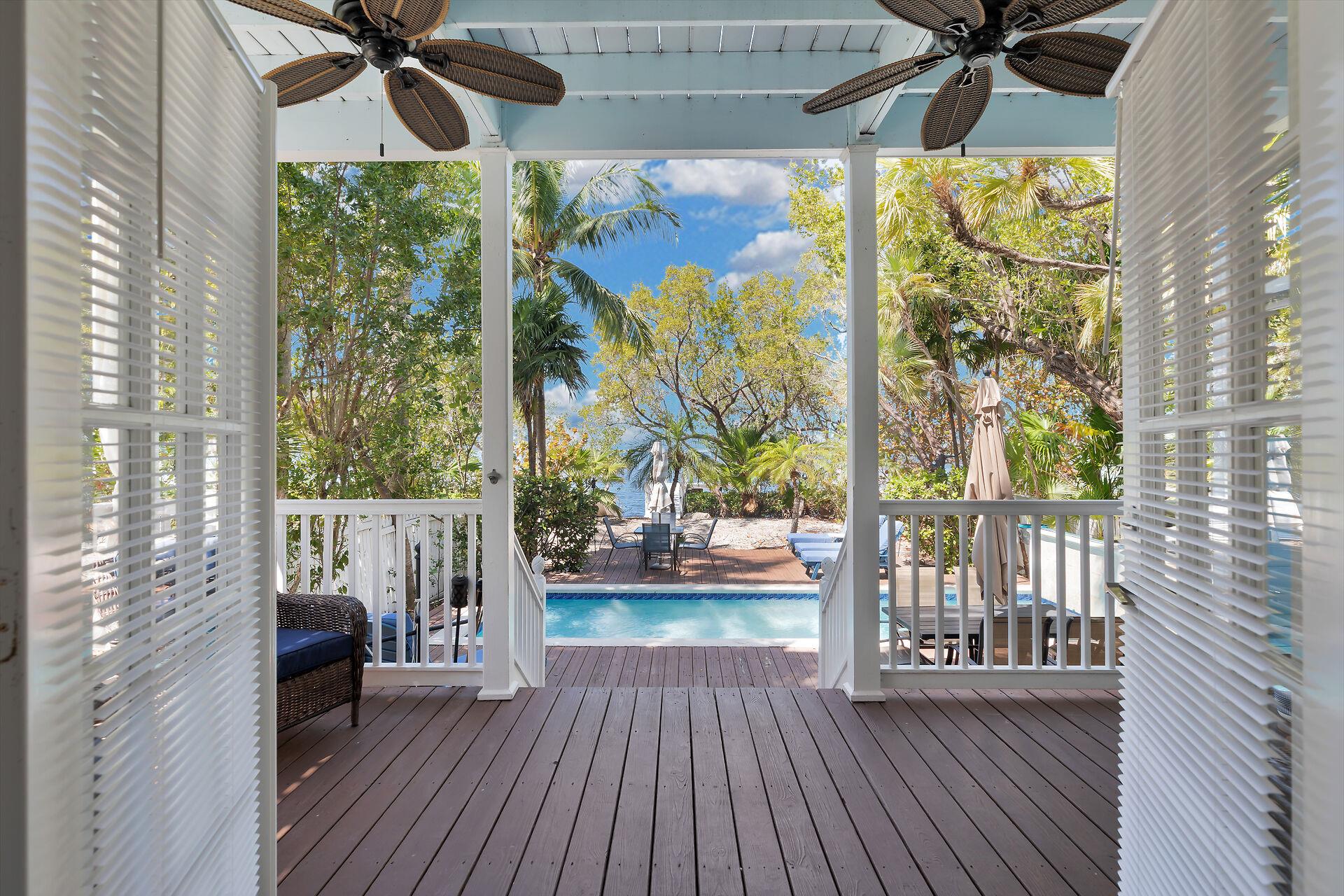 Sweeping doors open wide to the spacious porch.