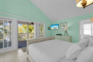 A bright and roomy primary with balcony access.