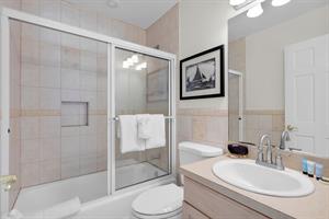 Shared hall bathroom includes a showertub combo.