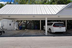 Dedicated covered parking spot for one vehicle.