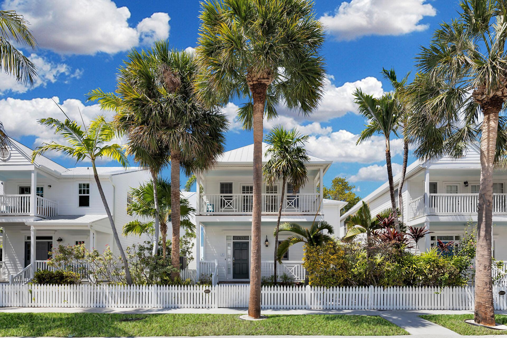 Palm trees and white picket fence Perfection.