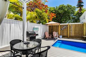 Outdoor grill, dining table and cocktail pool