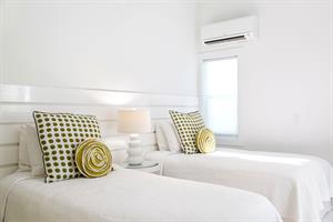 Twin bedroom on second floor, with ensuite bath.