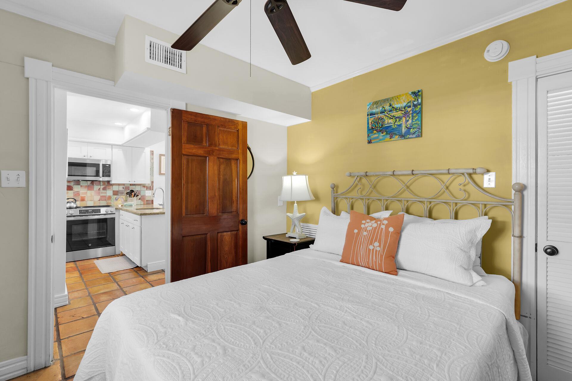 First floor queen bedroom with ceiling fan