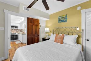 First floor queen bedroom with ceiling fan