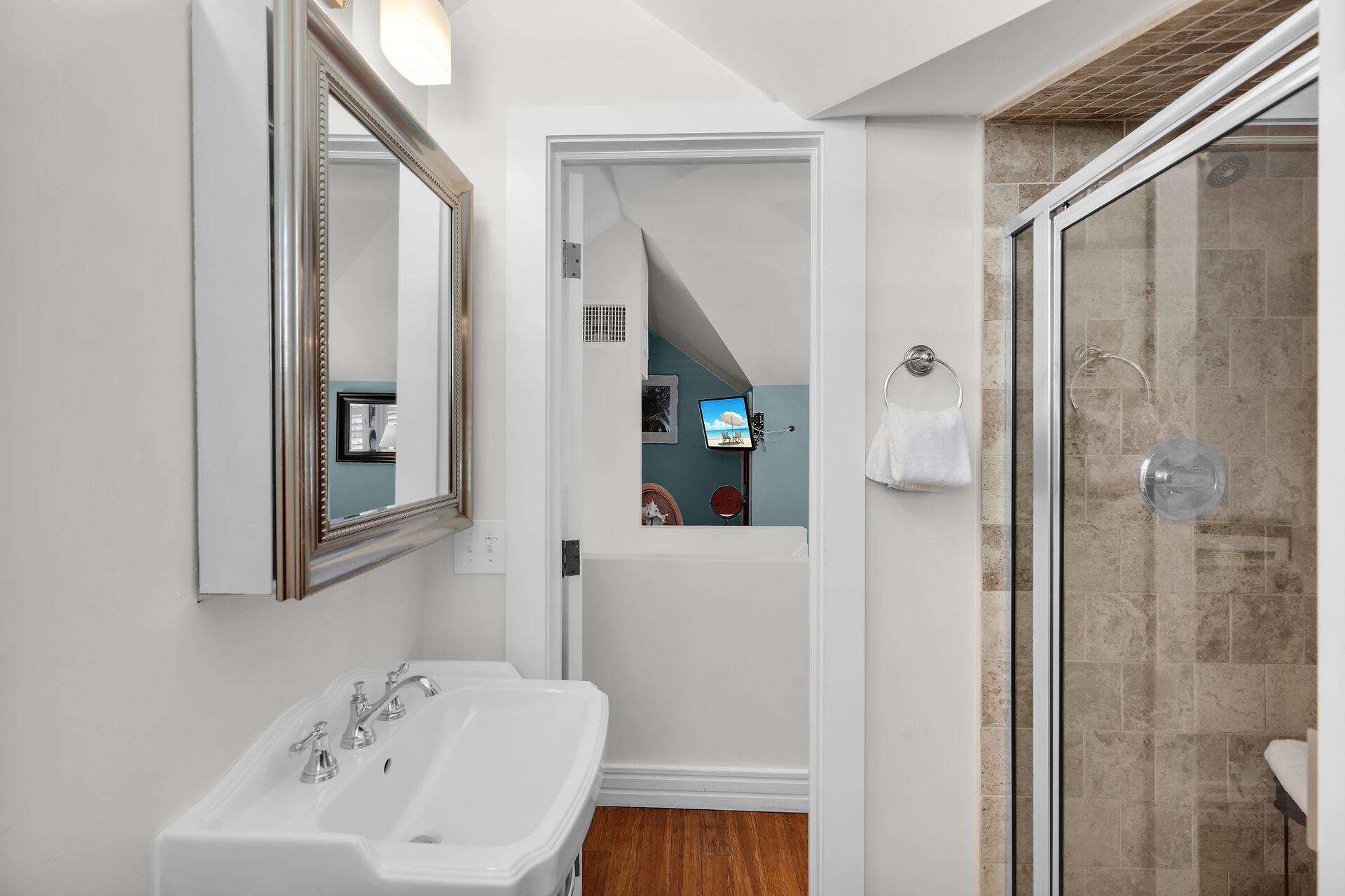 Ensuite bath with walk in shower in loft