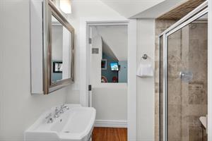 Ensuite bath with walk in shower in loft