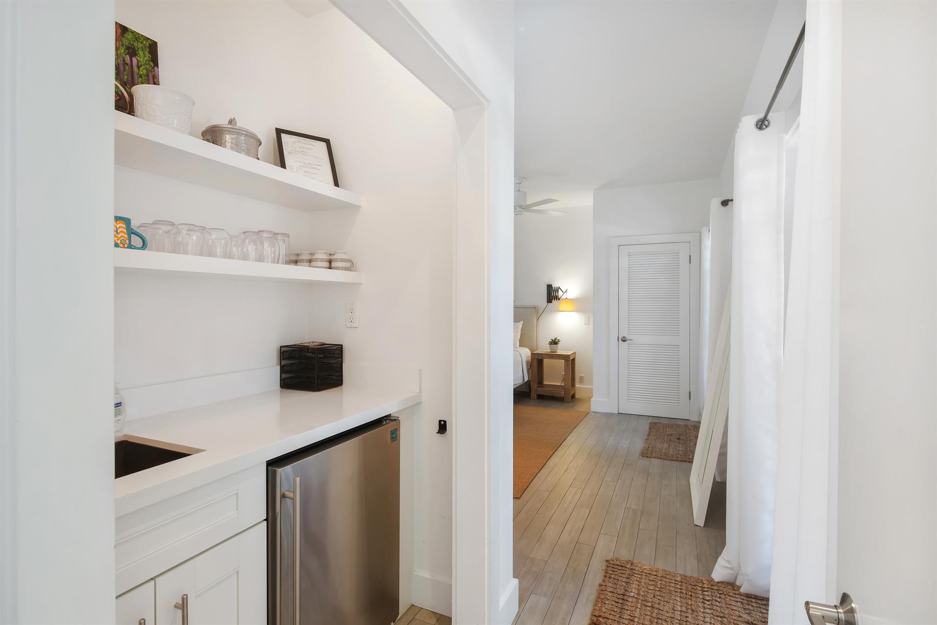 Wet bar and fridge between the king bedrooms for your convenience