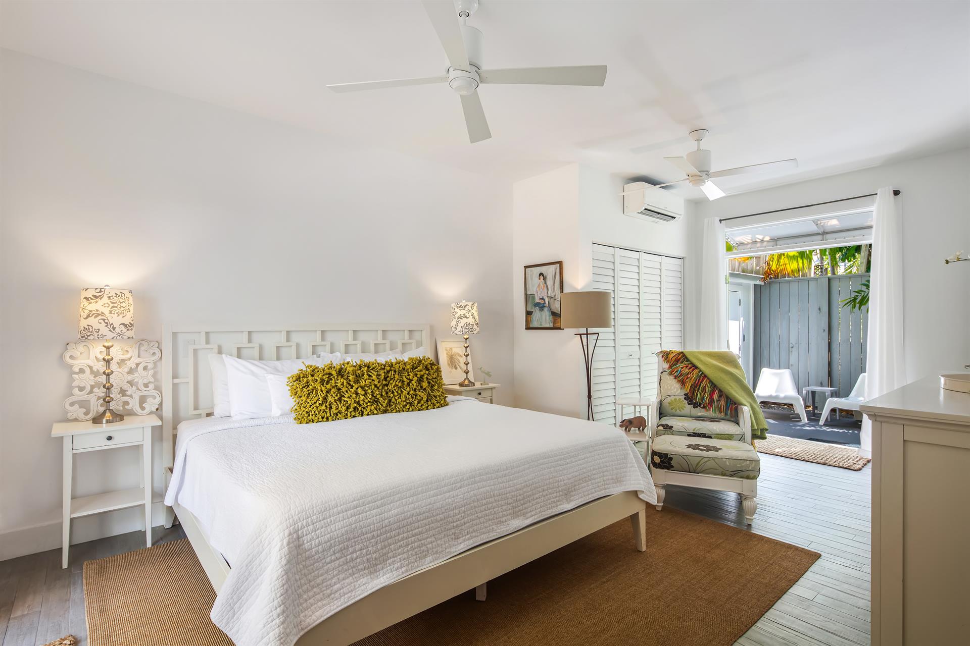 First level king bedroom with outdoor access, ensuite bath, and closet.