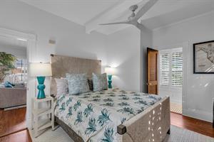 Queen bedroom with bedside lighting and ensuite