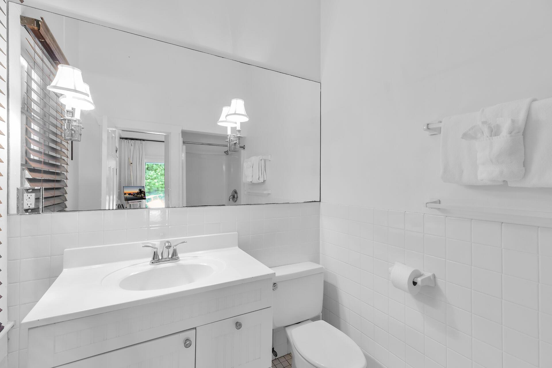 The full bath has a tiled walk in shower.