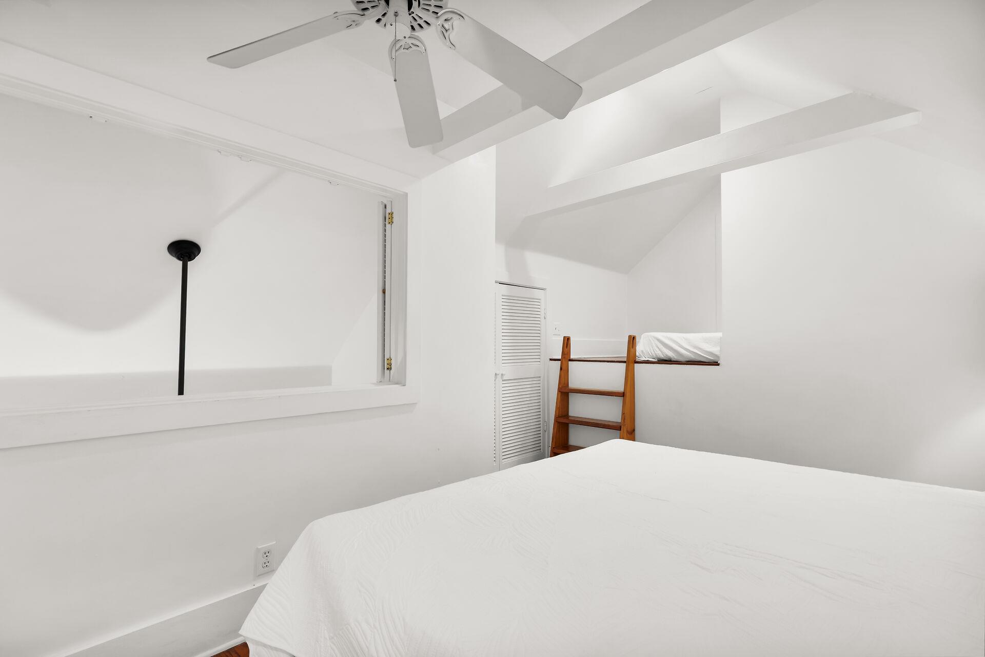 Open loft with full size bed for guests.