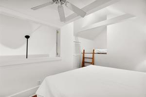 Open loft with full size bed for guests.