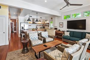 Living area offers ample seating and has a large TV