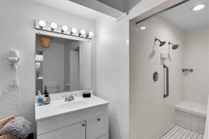 The full bath has a tiled walk in shower.