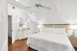 King bedroom with vanity and sink.