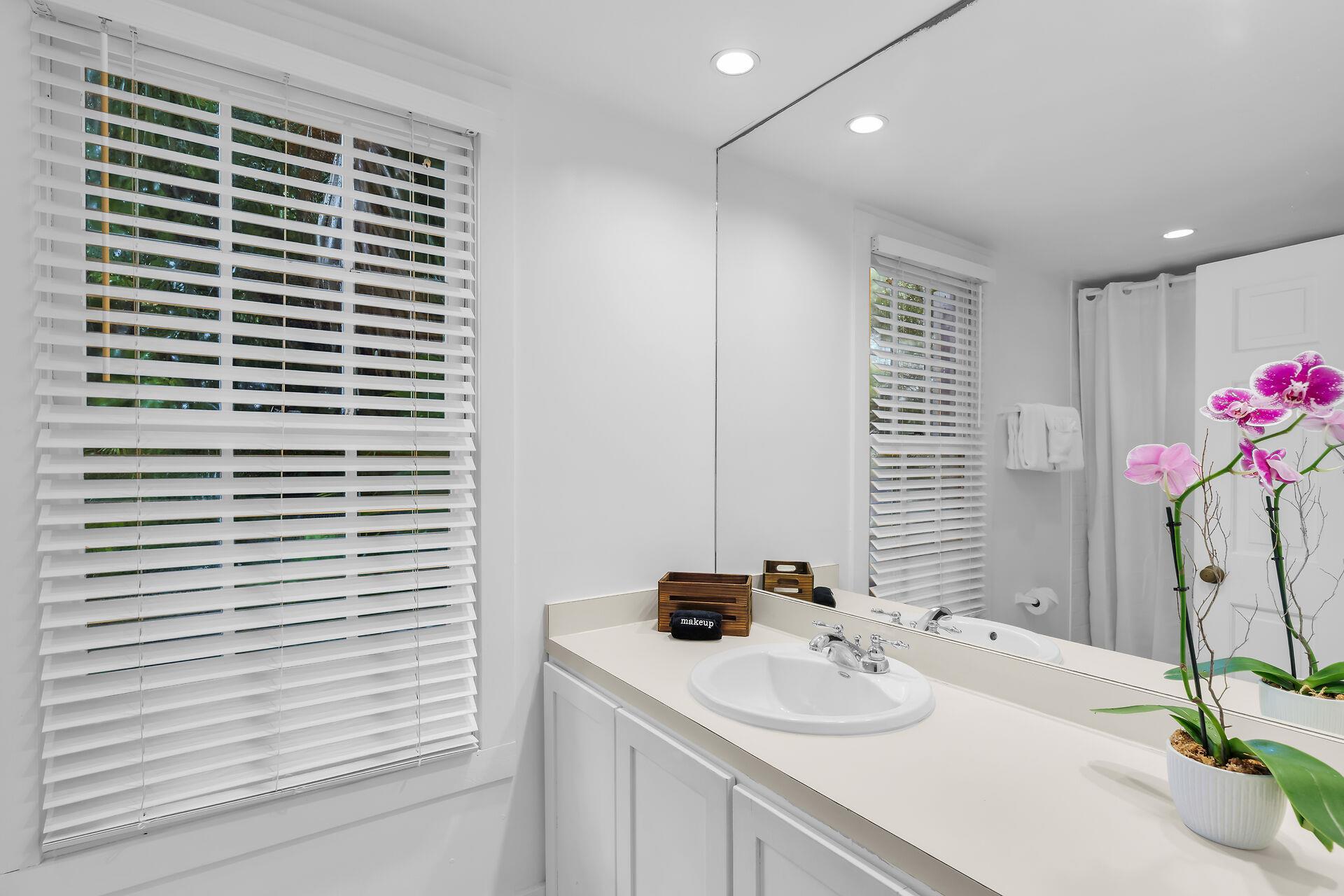 Full bathroom has a walk in tiled shower