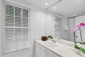 Full bathroom has a walk in tiled shower