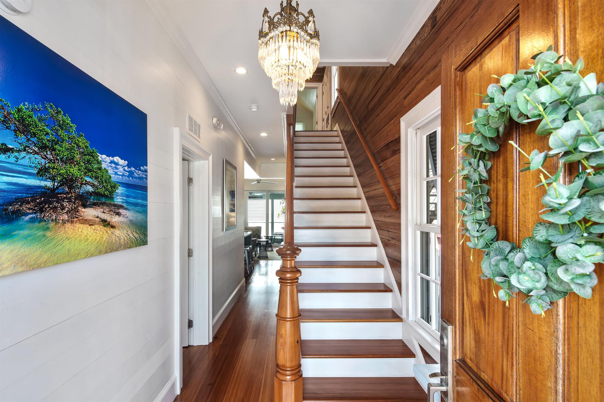 Gorgeous stairway leads to three bedrooms upstairs