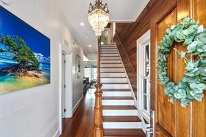 Gorgeous stairway leads to three bedrooms upstairs