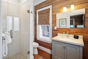 Ensuite bathroom with Dade County pine and glass walk in shower