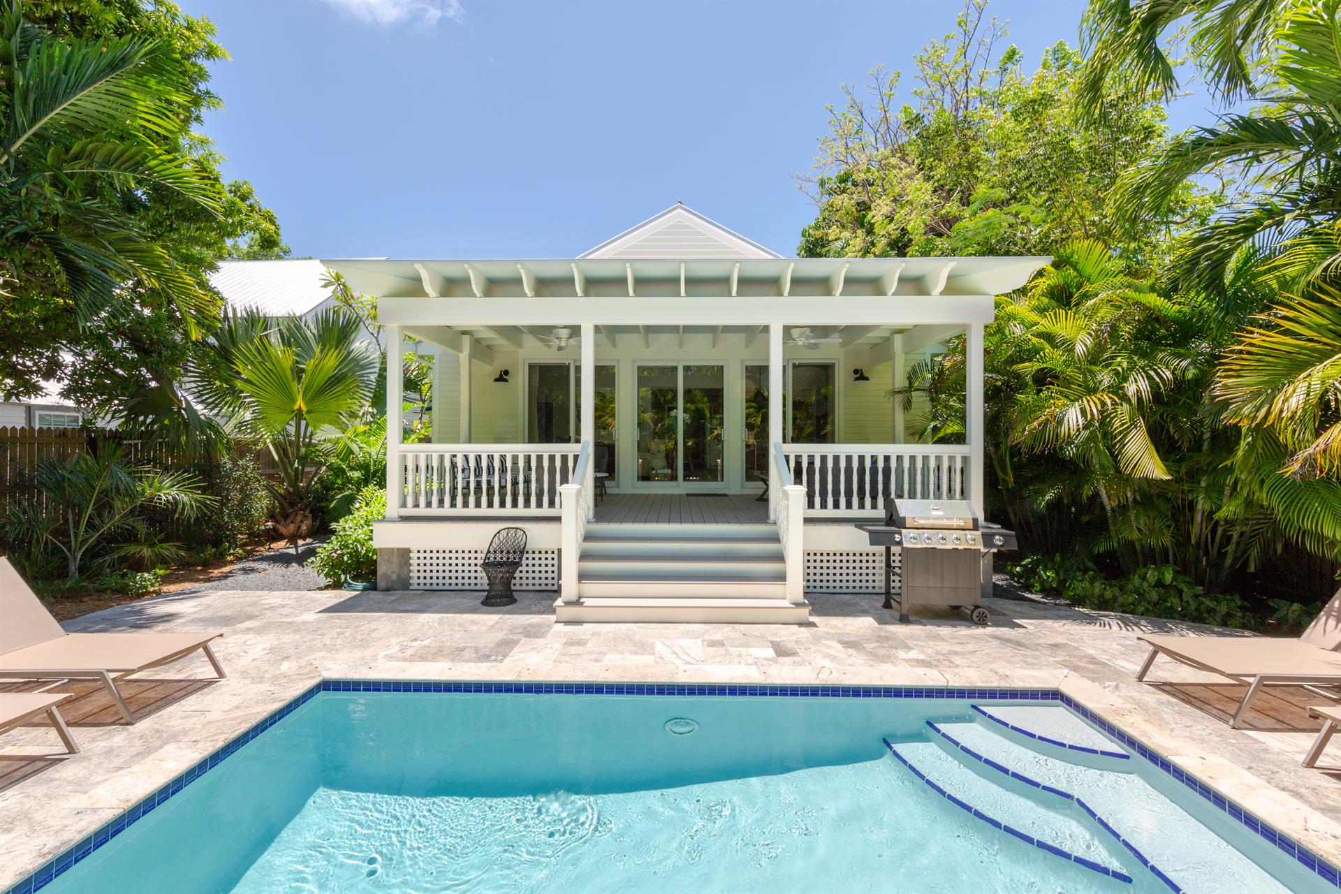 Step off this amazing shaded porch, into your own sunny pool